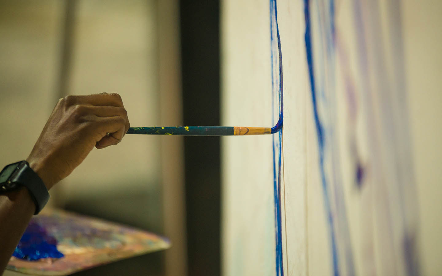 Artist painting on canvas