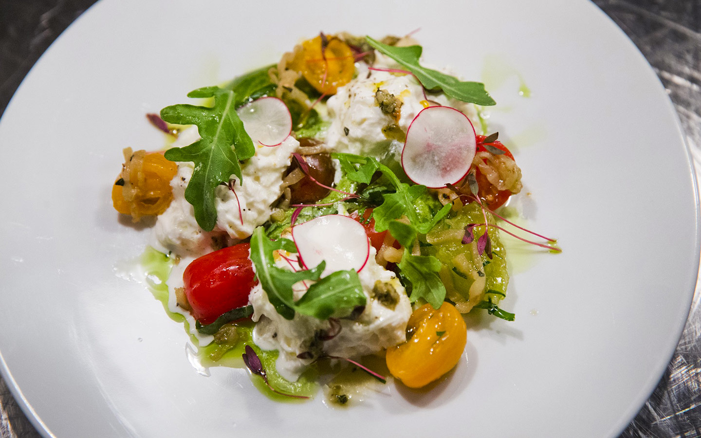 Scarpetta's elegant plating of the burrata salad